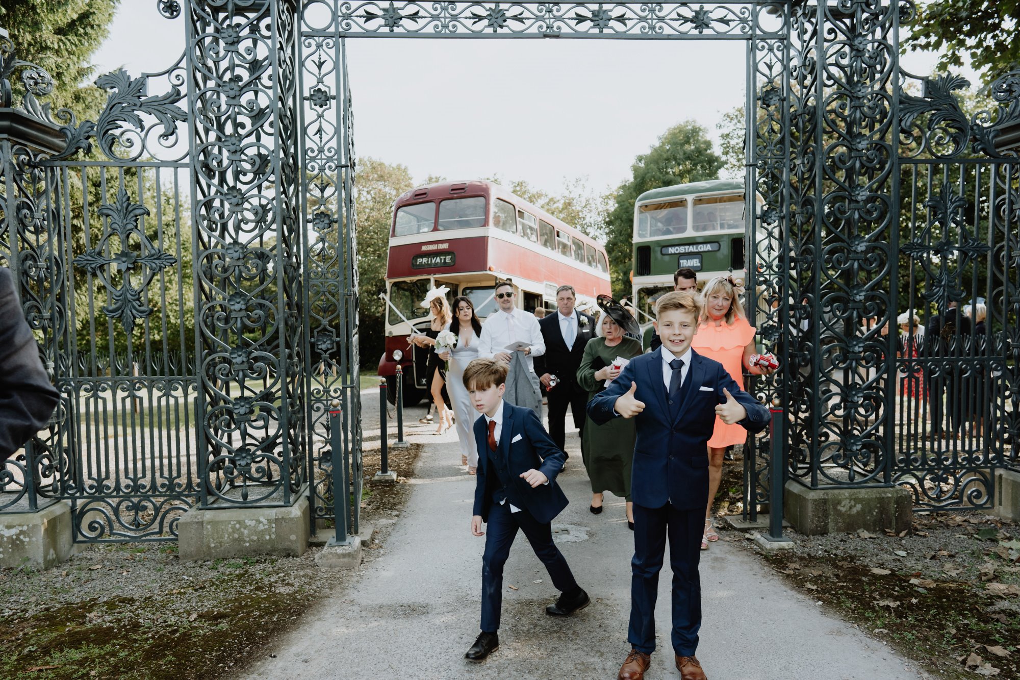 wedding guests arriving at the main gates for a vintage garden party jubilee inspired wedding