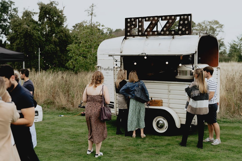 Wedding pizza from a cool truck with light up sign at wedding fair in the cotswolds