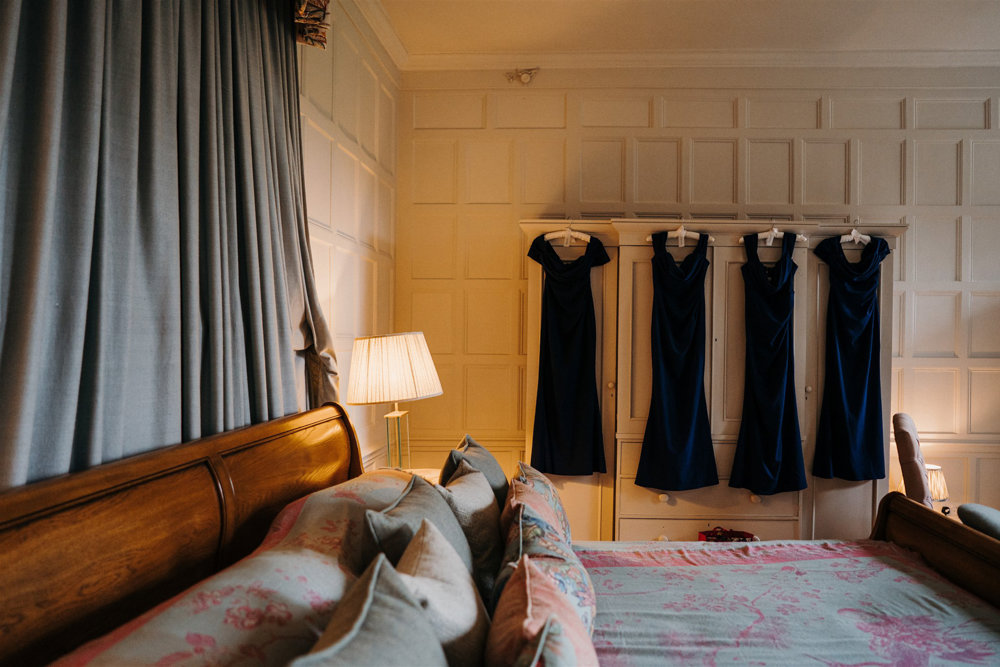 Gorgeous caesar bed in master suite at Elmore Court for wedding night with unique indian style furnishing and throws by Shibumi