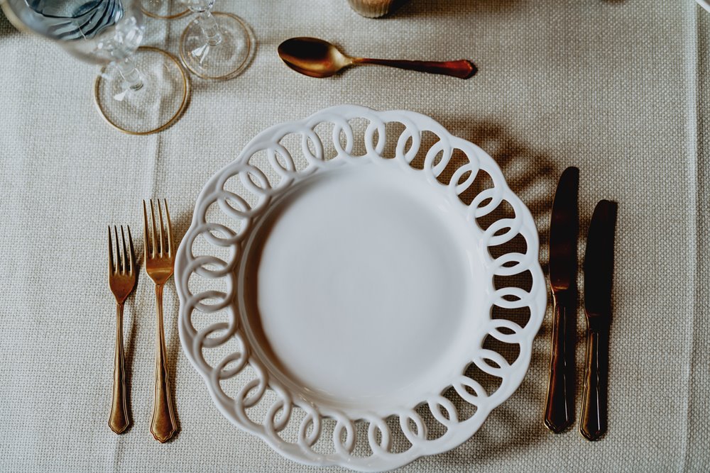 Luxe wedding plates on tables