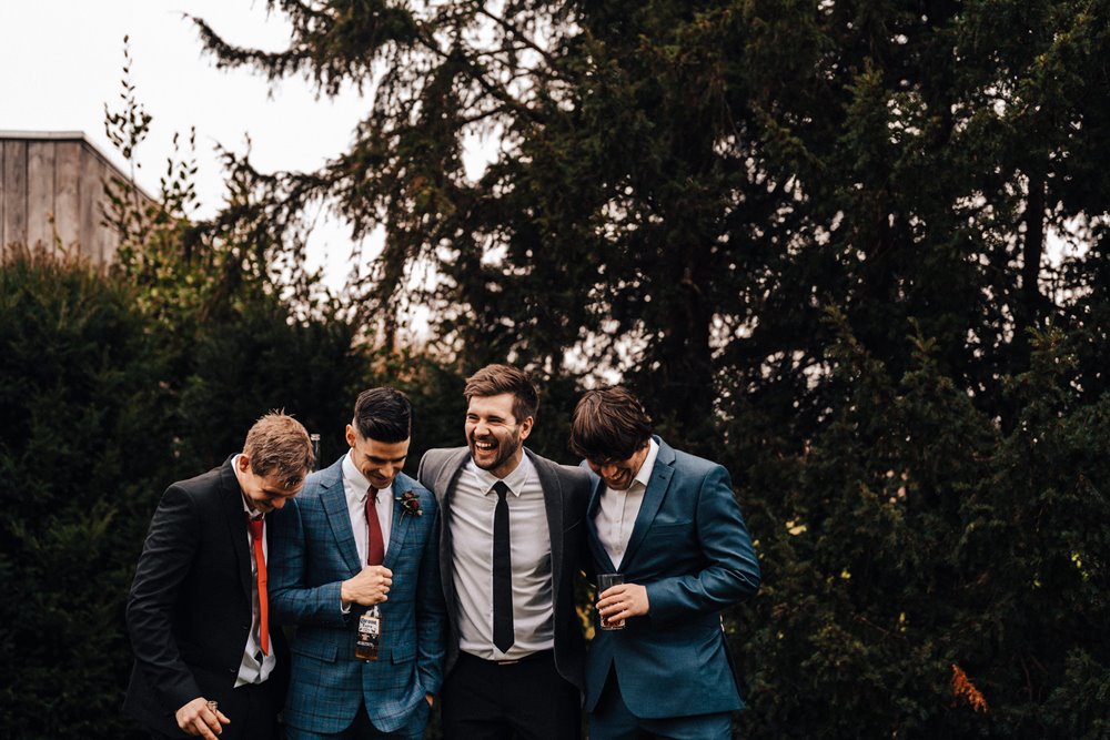 groomsmen posing for fun photos