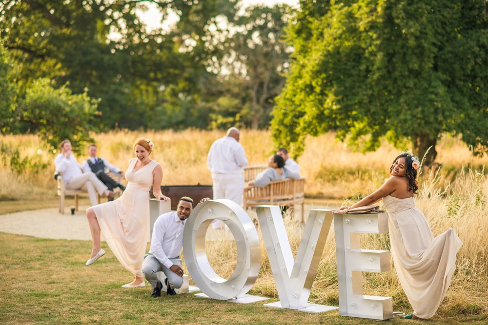 Love wins at Elmore Court. Guests having fun at Gay wedding in the grounds