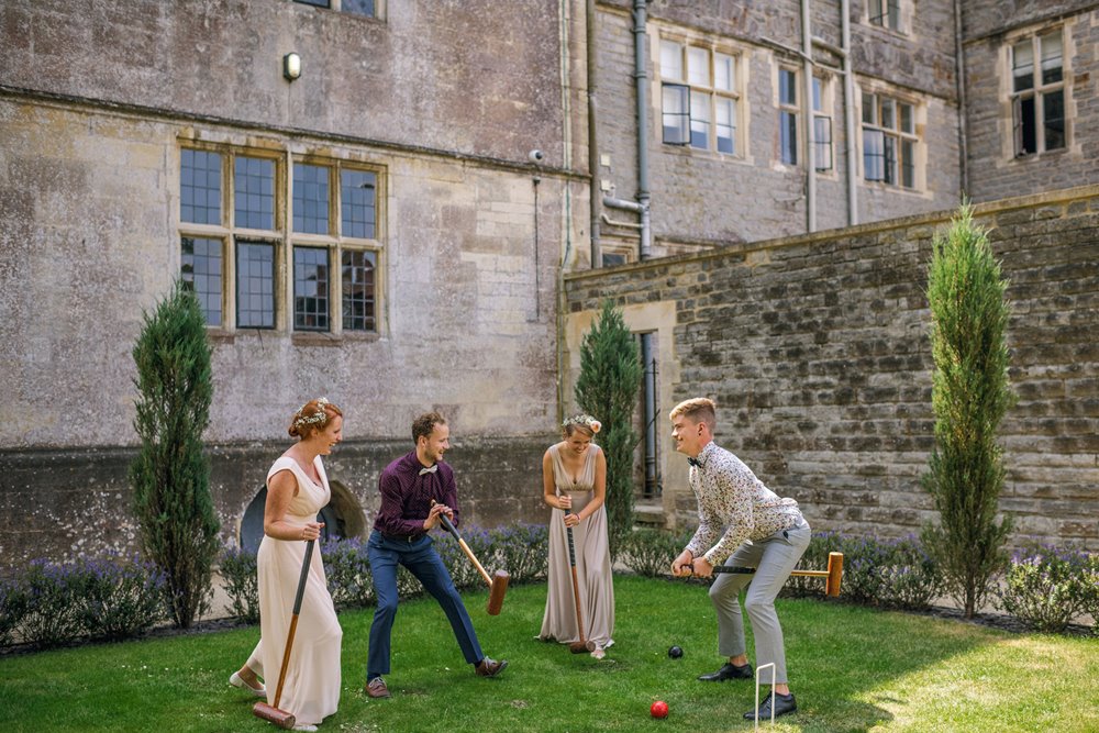 Guests having fun at same sex outdoor wedding reception 