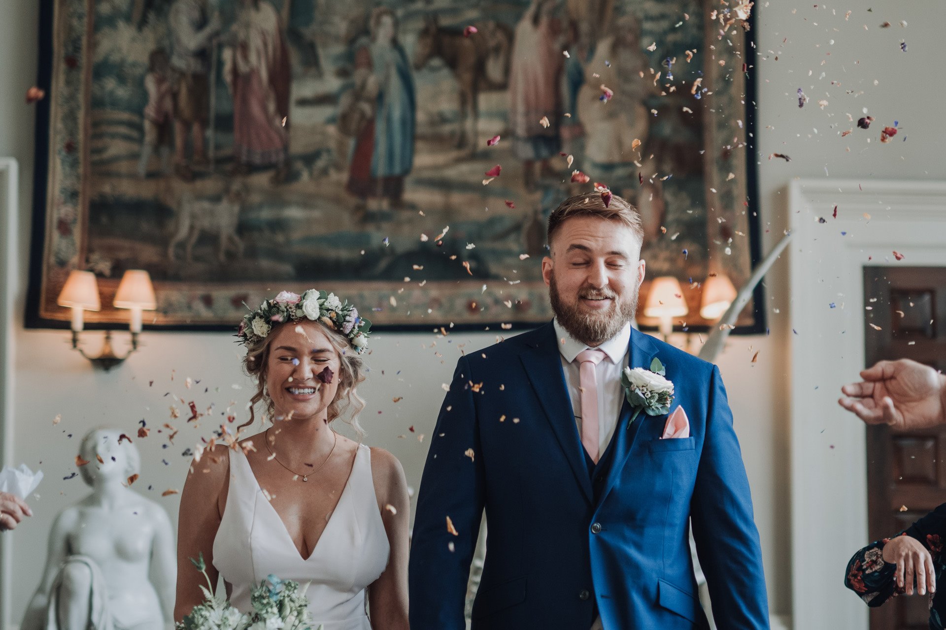 Confetti thrown at bride and groom at a micro wedding ceremony at elmore court during covid pandemic