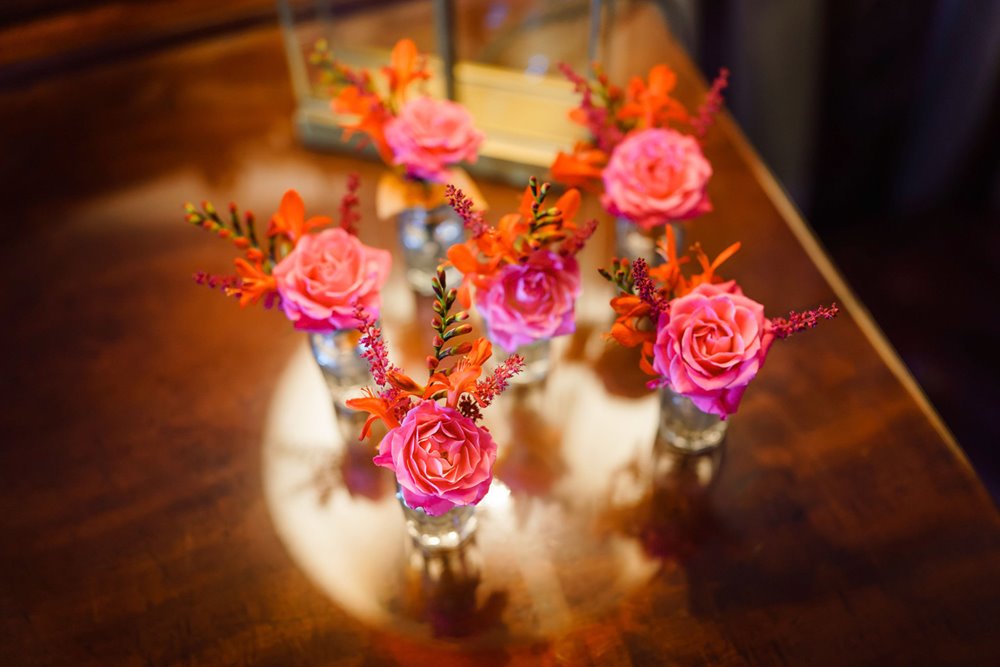 bright pink buttonholes for a jewish wedding in the summer at elmore court
