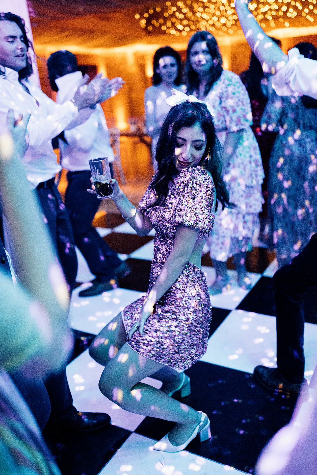 Second dress for wedding reception bride stuns guests in short sequin party dress on the dance floor at elmore court in the cotswolds