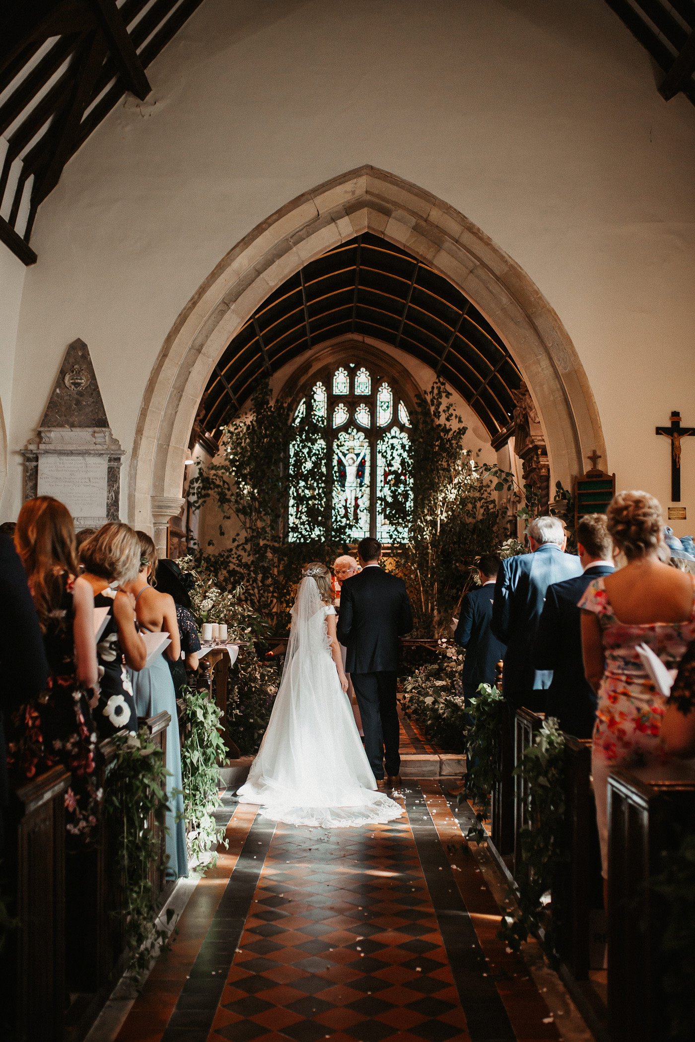 Bride and groom getting married in church in england