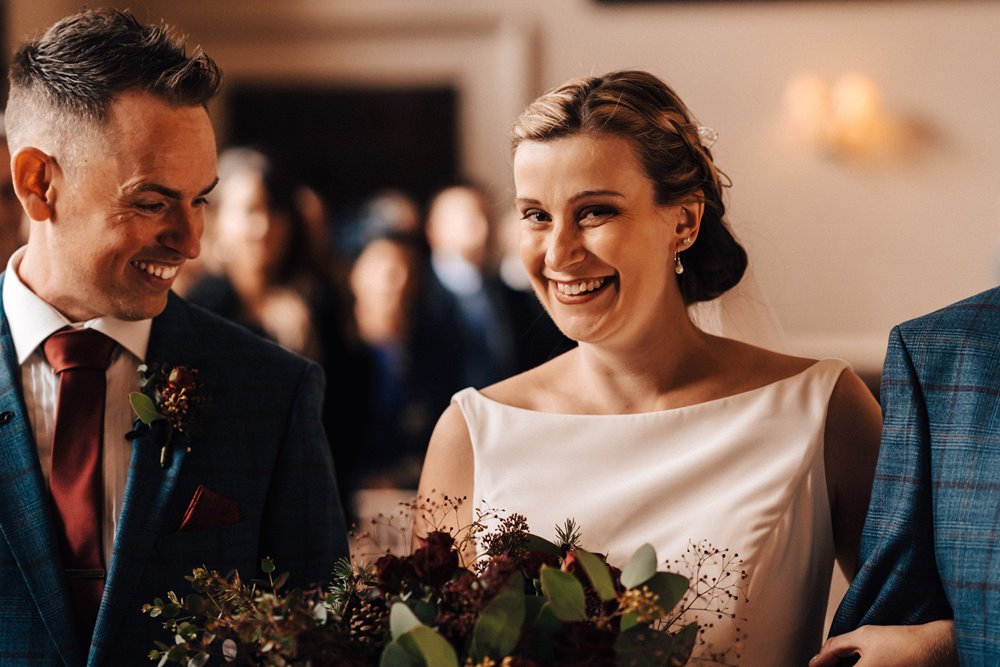 bride and groom in winter wedding ceremony