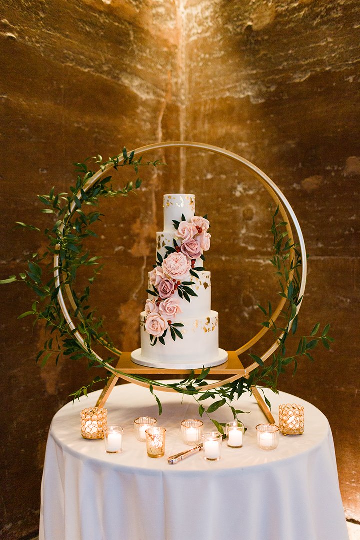 Luxe 4 tier wedding cake with pink roses on beautiful display table at elmore court