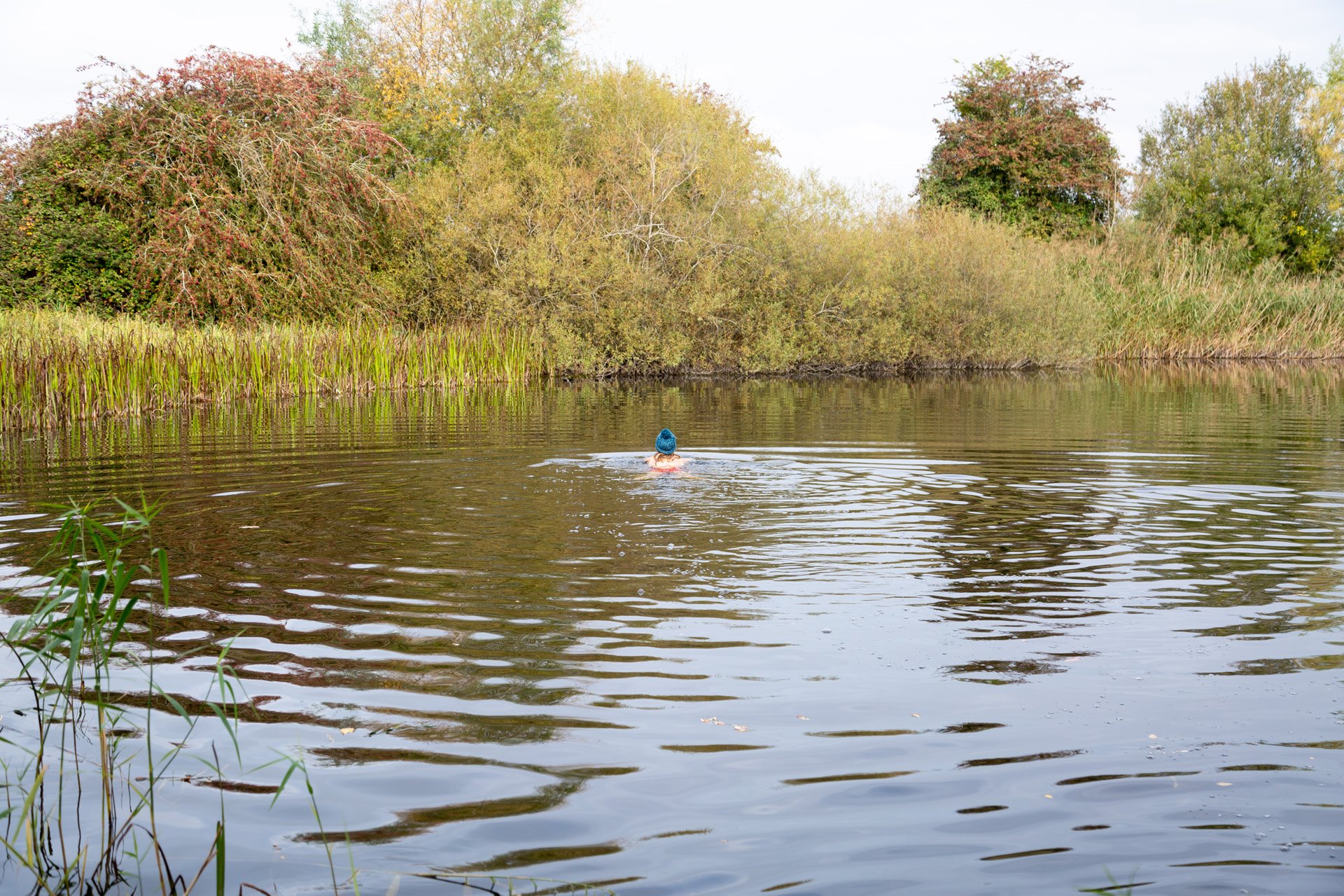 Wild swimming at a secret spot in the cotswolds at rewilded wedding venue elmore court