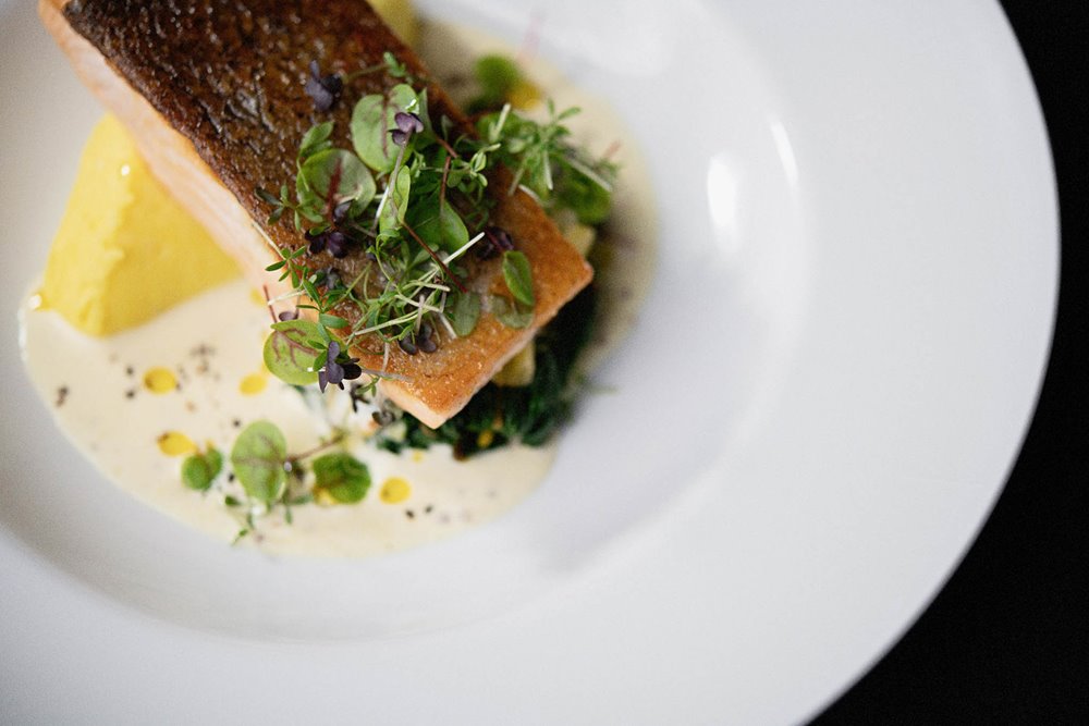 Wedding food- Roast salmon fillet, saffron infused mashed potato, Swiss chard, white wine & grain mustard cream