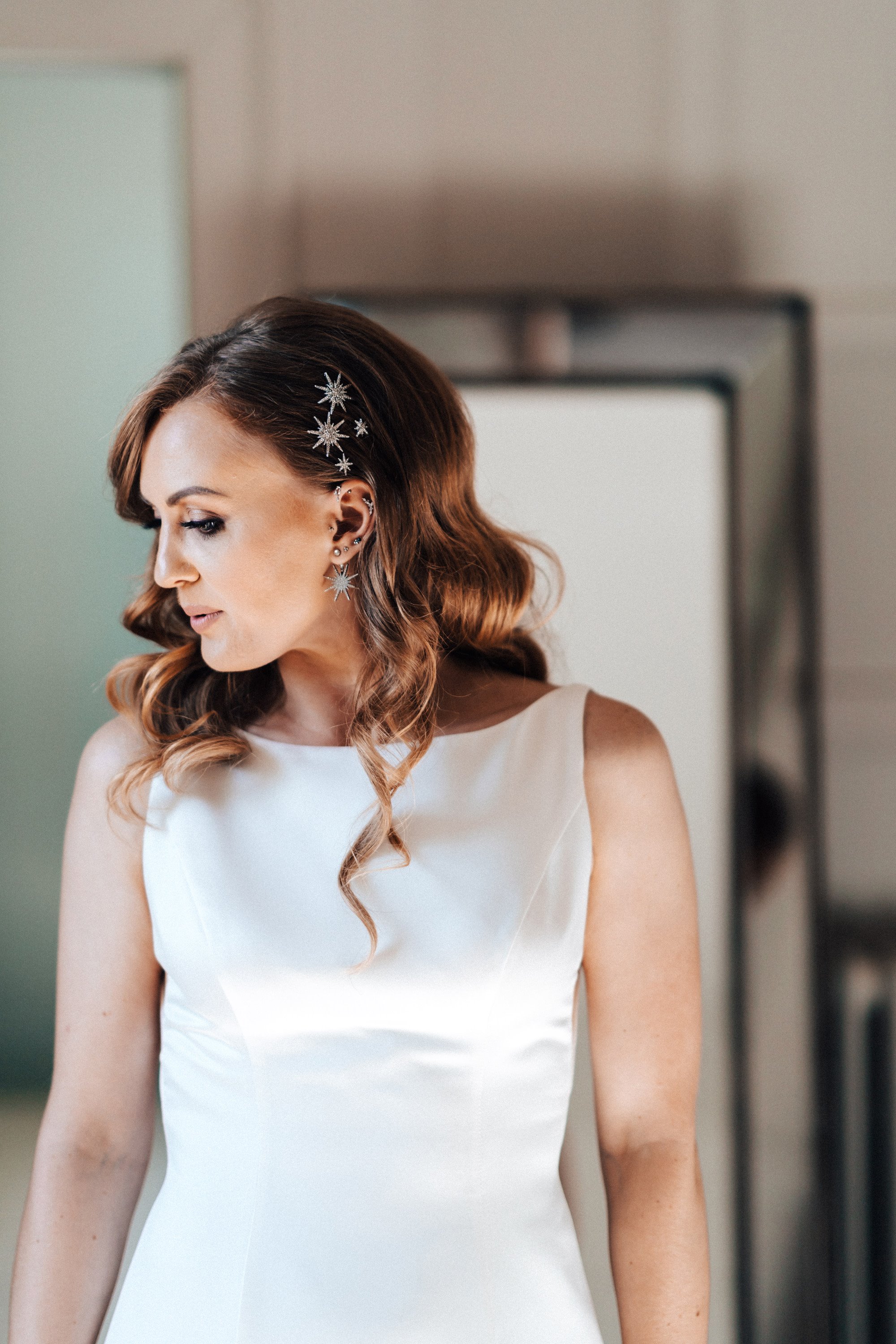 Bride with glamorous hollywood waves and celestial starry pins for an autumn wedding in a stately home