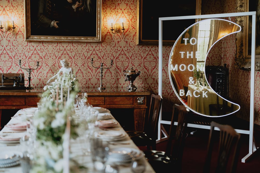 Luxe modern wedding details in dining room of stately home wedding venue in gloucestershire