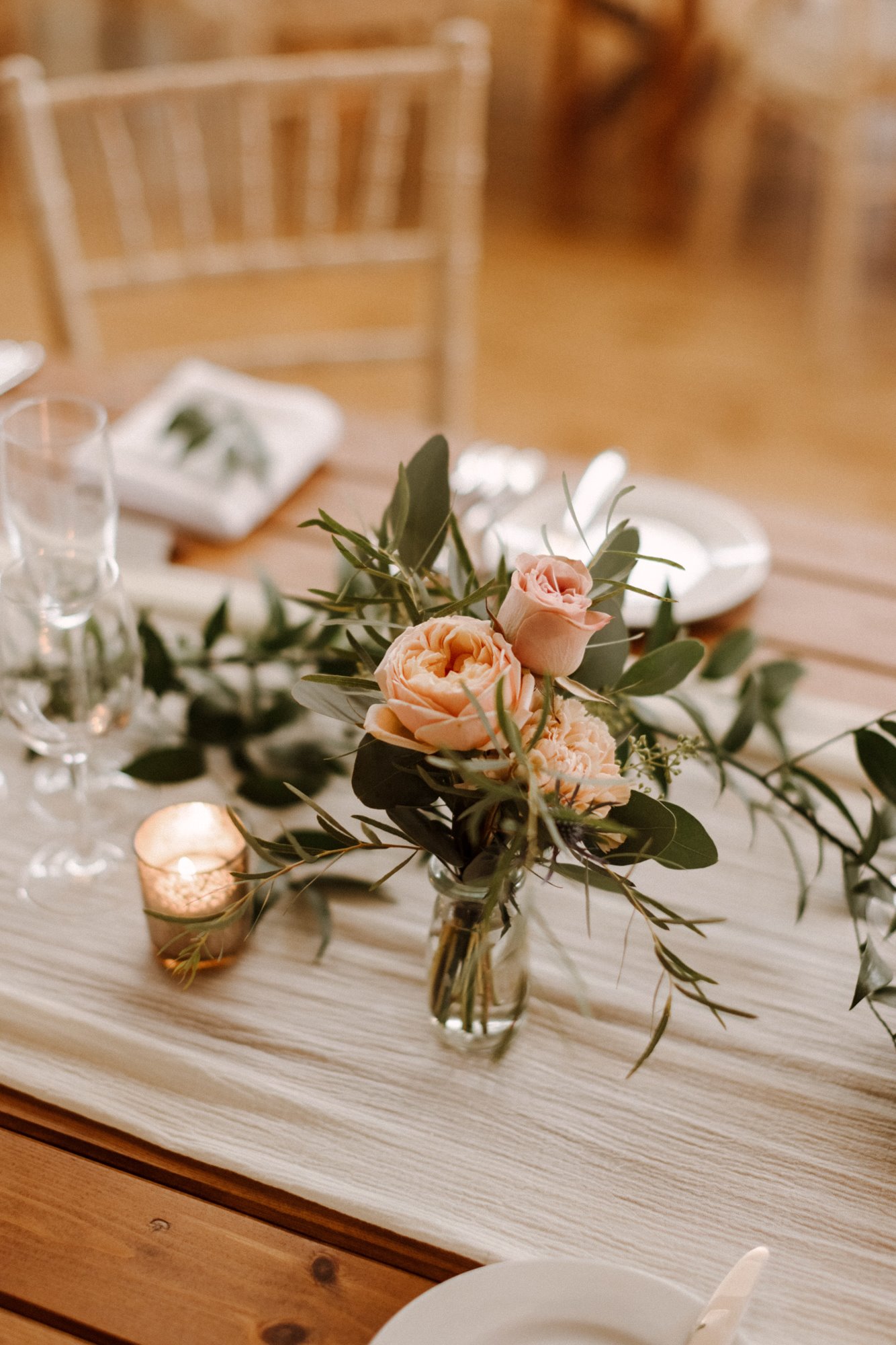 September wedding flowers on tables at sustainable wedding venue in the cotswolds