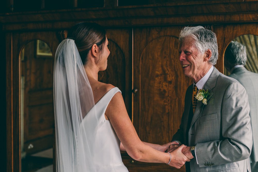 father of the bride first look at bride ready to marry at her mico wedding at elmore court