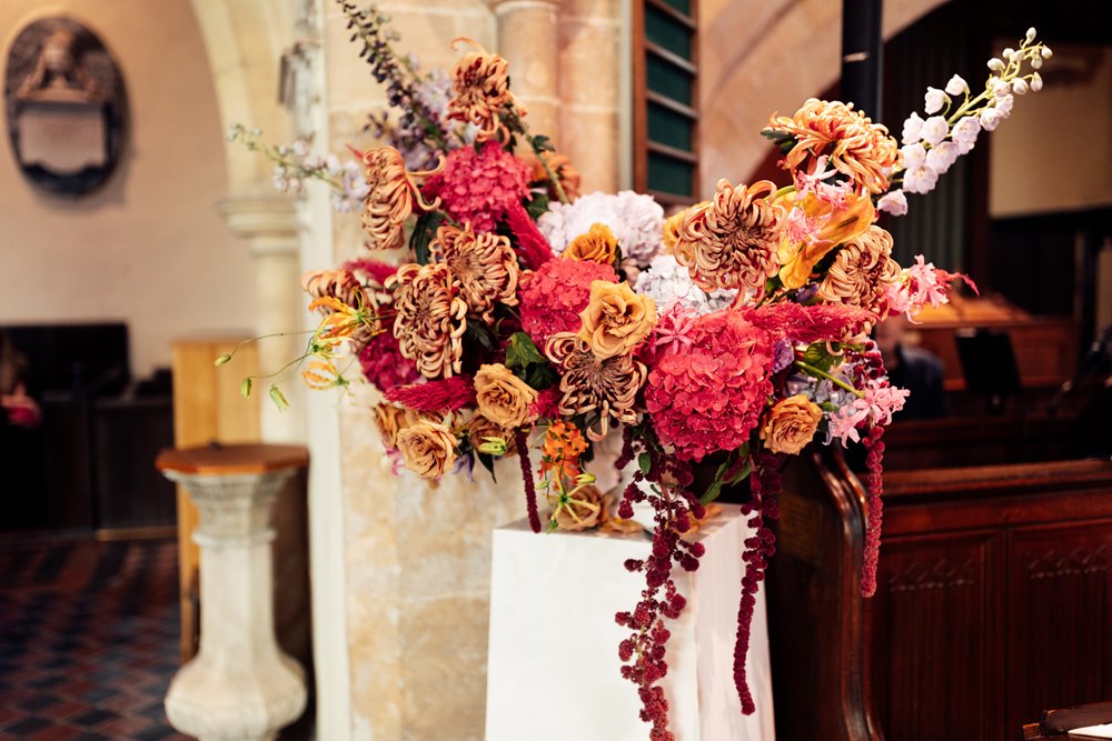 colourful wedding flowers in church