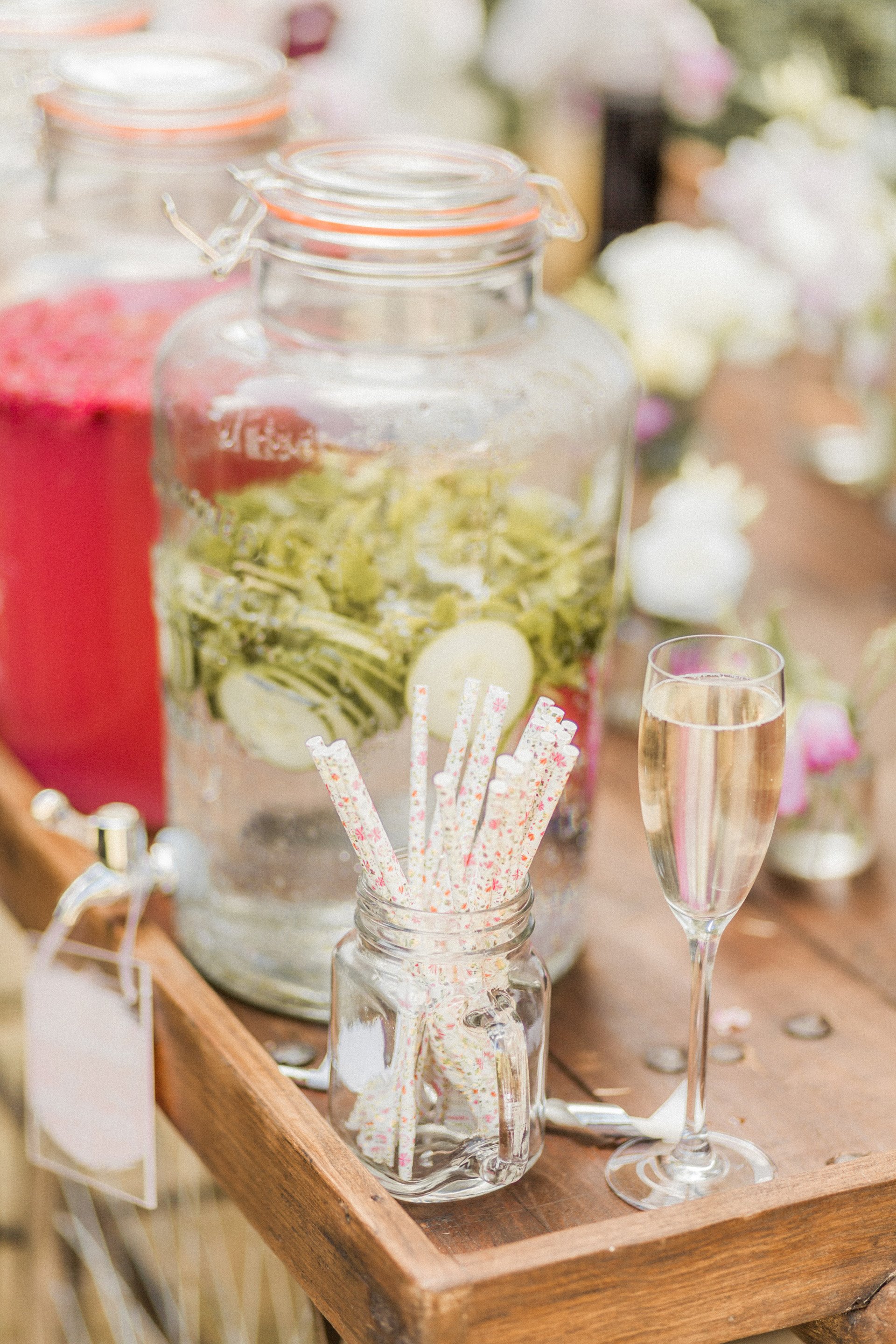 Drinks station with big kilner containers of refreshing drinks for outdoor wedding reception