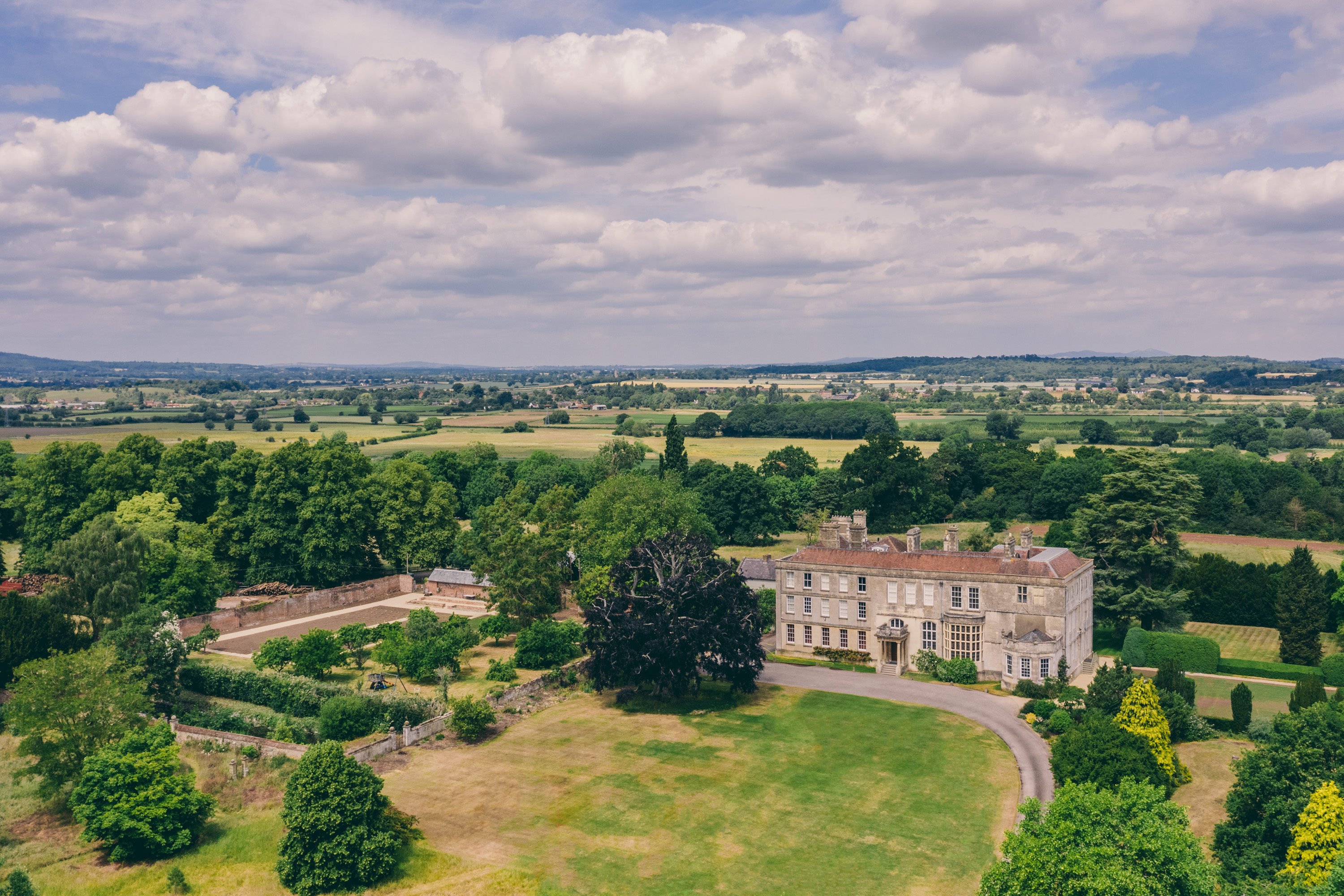 Sustainable wedding venue elmore court and walled garden from above