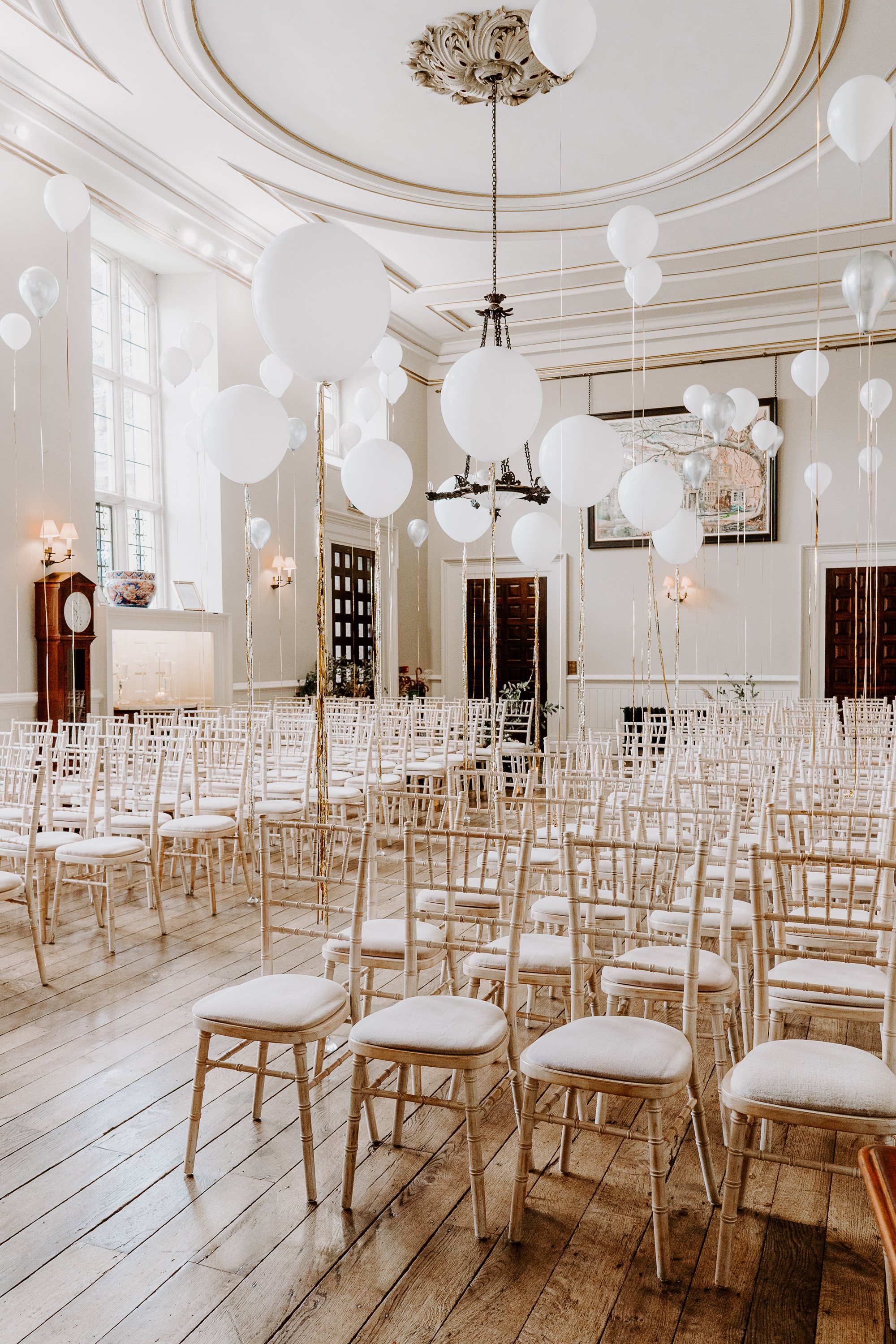 White balloons decorating the historic hall ceremony room look like pearls on strings at elmore court