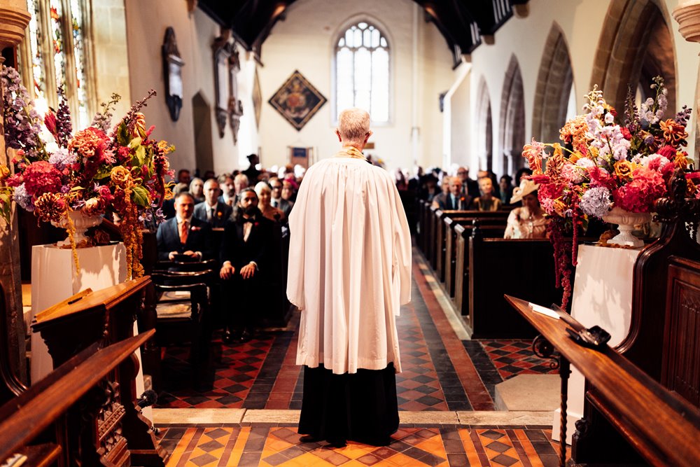 church wedding at elmore in the cotswolds with colourful flowers