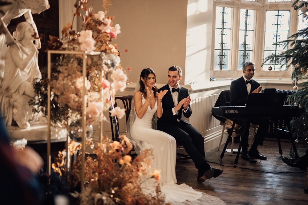 Luxe wedding flowers for a black tie christmas wedding ceremony in a stately home in the cotswolds