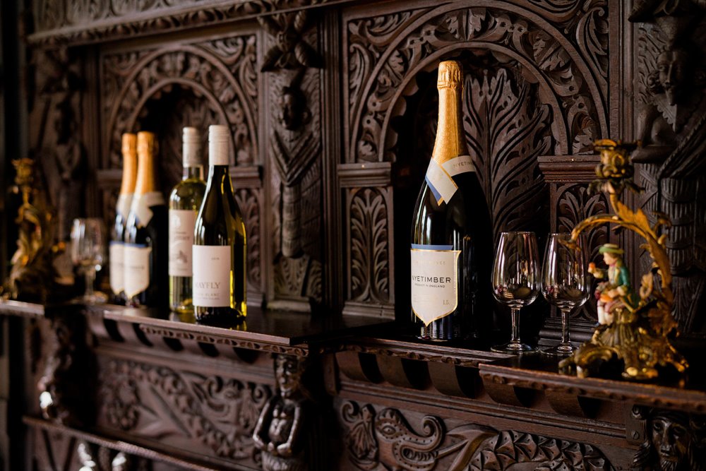 sommelier giving wine advice and tasters at wedding fair in the cotswolds