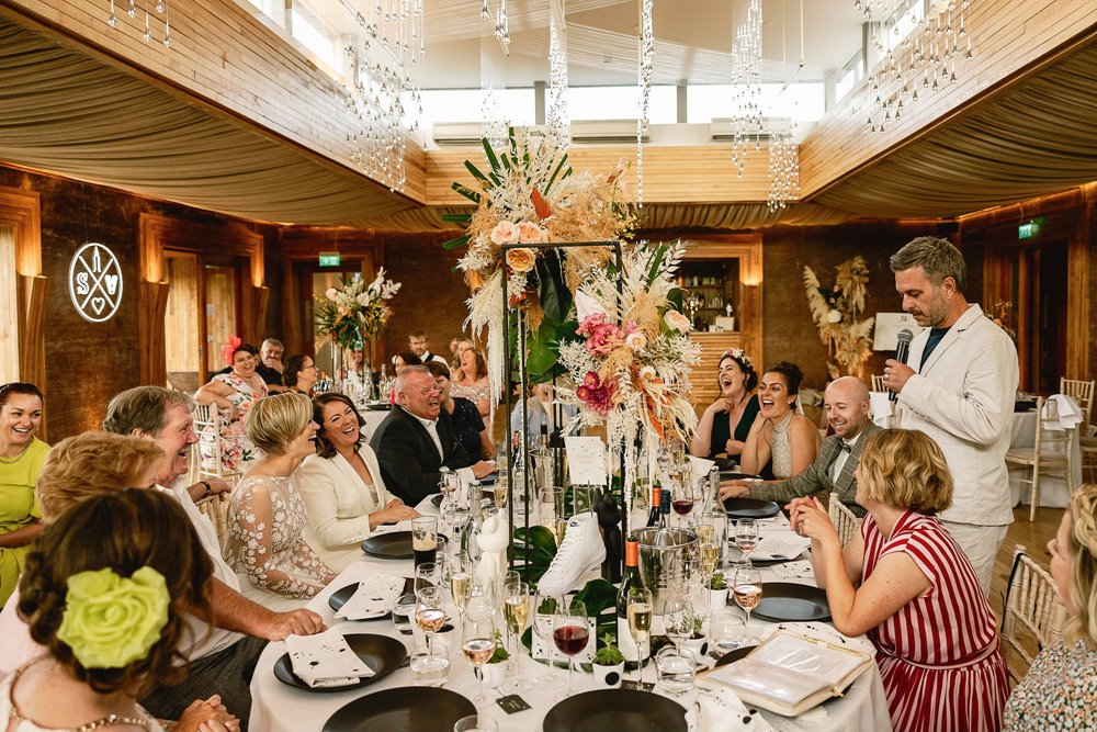 Lesbian wedding reception with monochrome details and tropical flowers