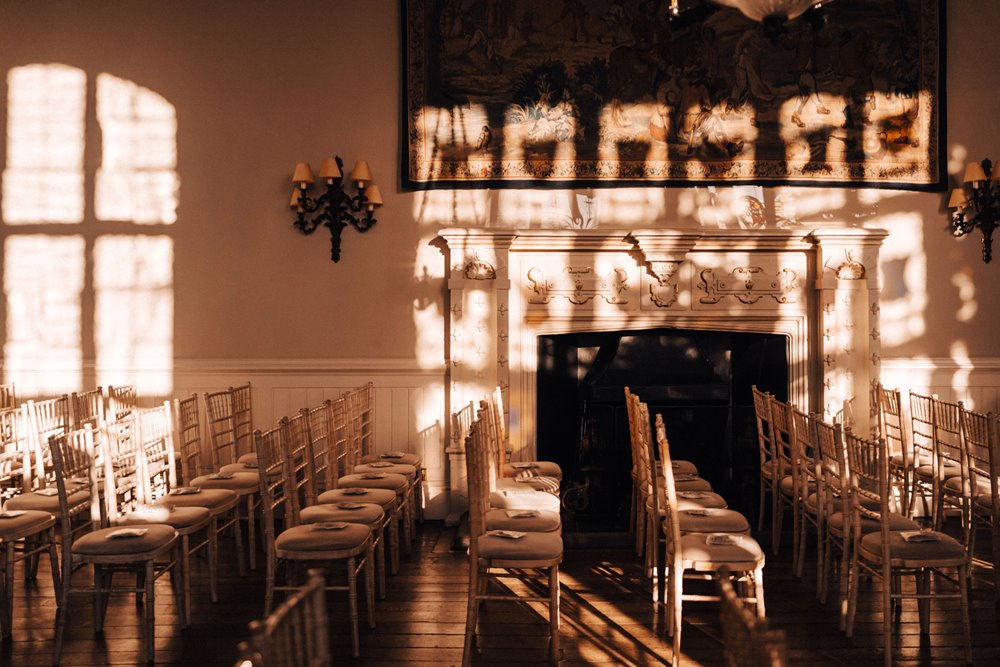 beautiful winter wedding venue for a ceremony with stained glass reflection on the walls