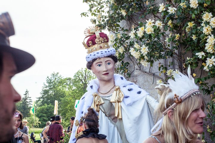 Giant sculpture of the queen at a secret garden party wedding with a jubilee twist in the walled garden of manor house elmore court in Gloucestershire