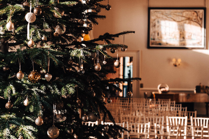 Huge Christmas tree in a beautiful stately home winter wedding venue in the Cotswolds
