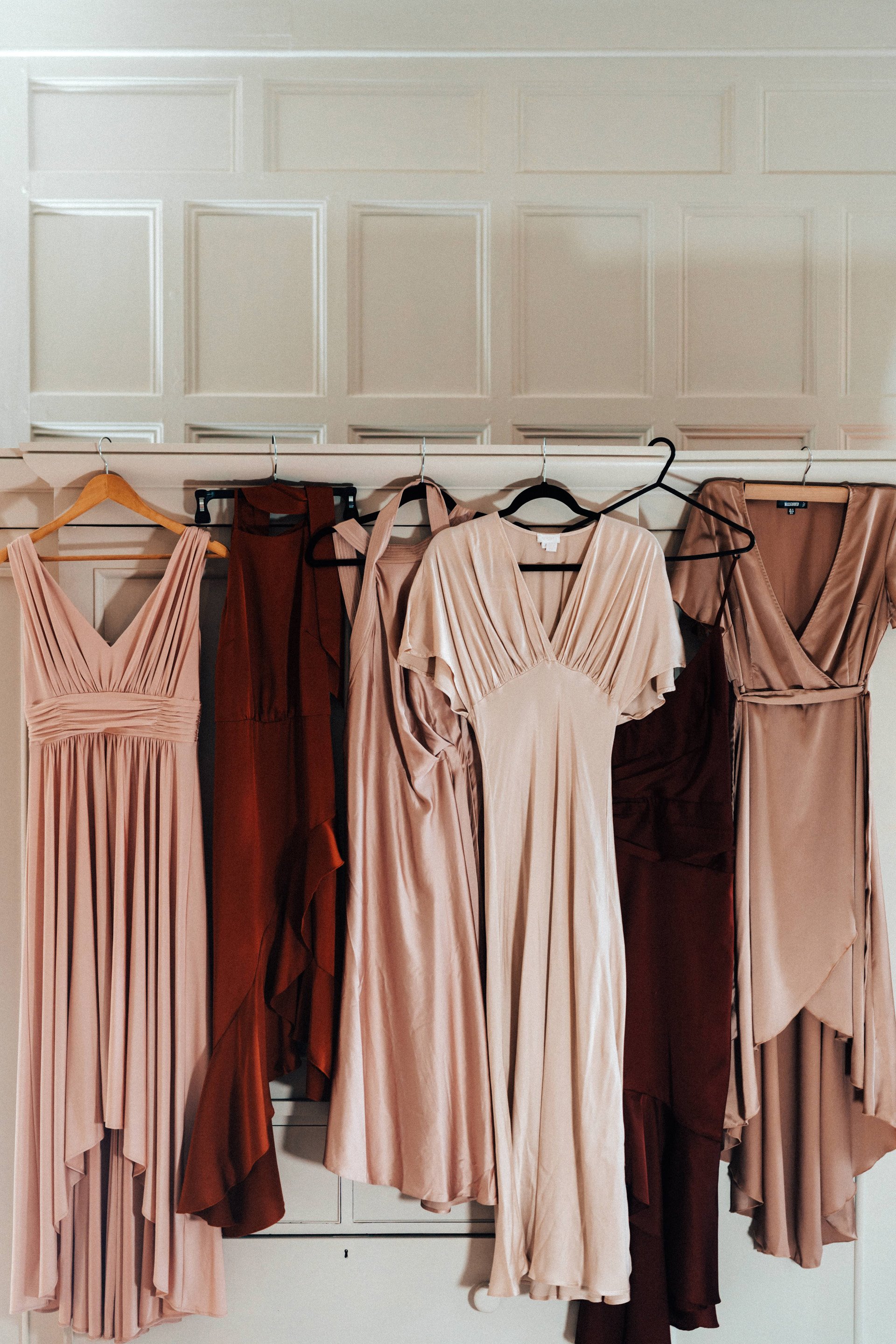 Blush pink wedding outfits for a September wedding with a golden theme