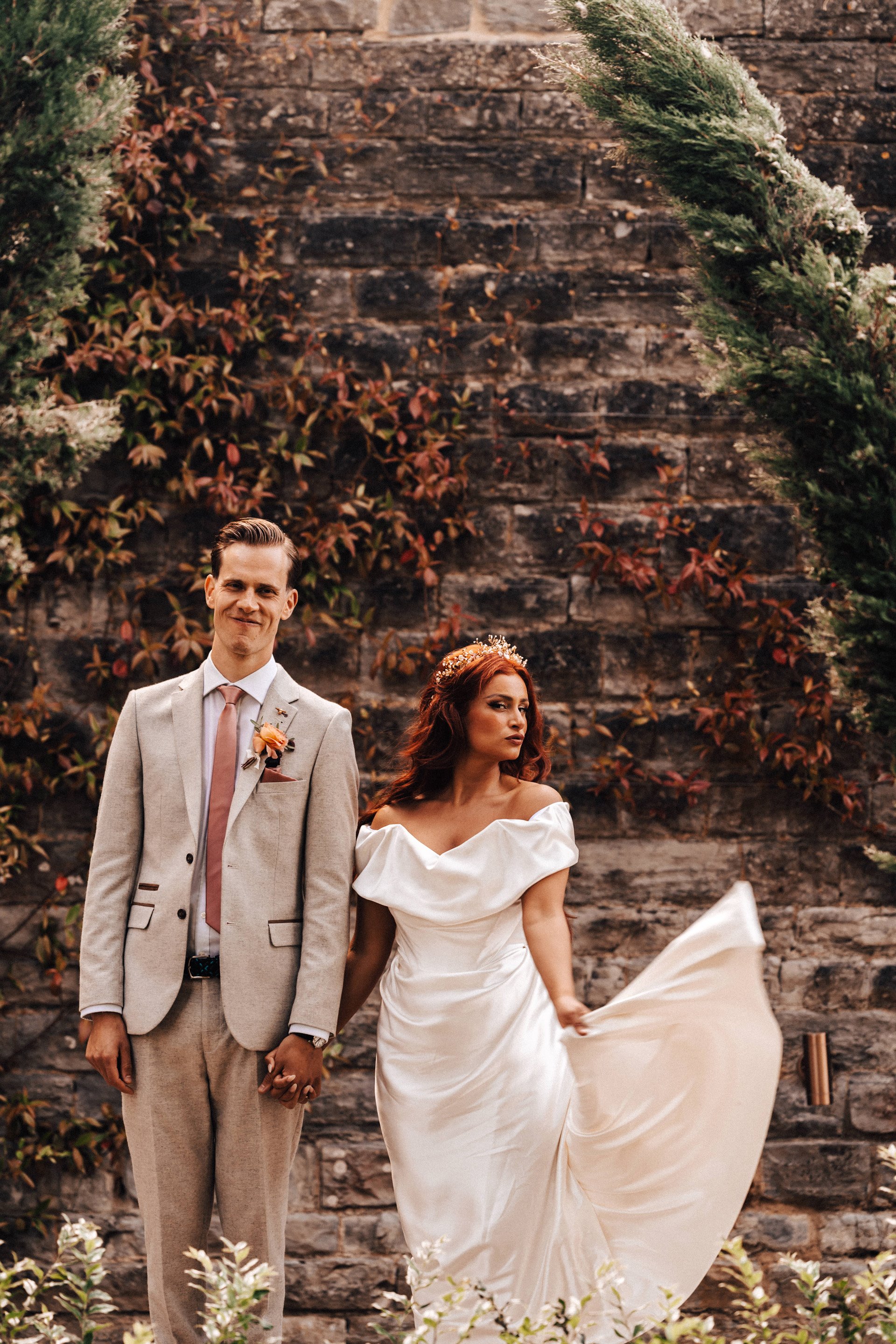 Beautiful bride in Vivienne westwood and groom pose at September wedding