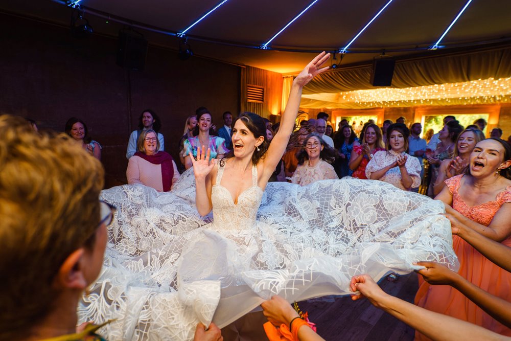 Jewish bride in huge wedding dress at her party wedding at elmore court