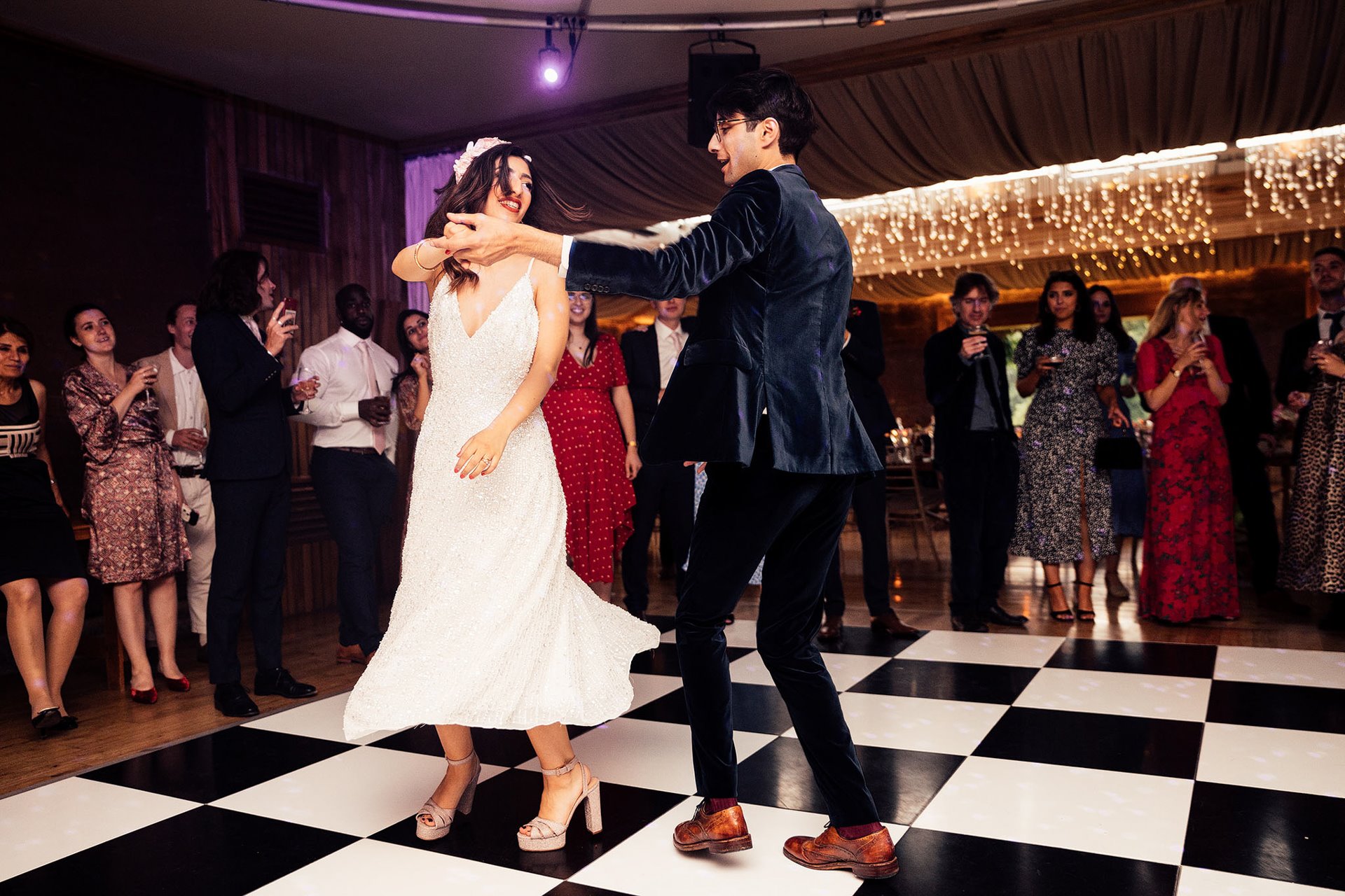 wedding after party dress change for first dance as bride spins and skirt swooshes on the dance floor 