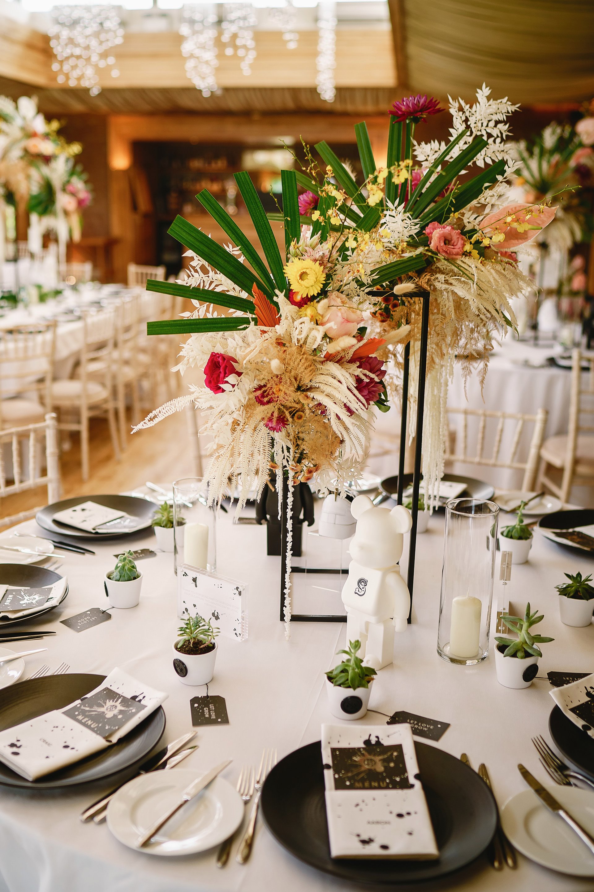 Tropical wedding floral centre pieces for lesbian wedding at Elmore Court