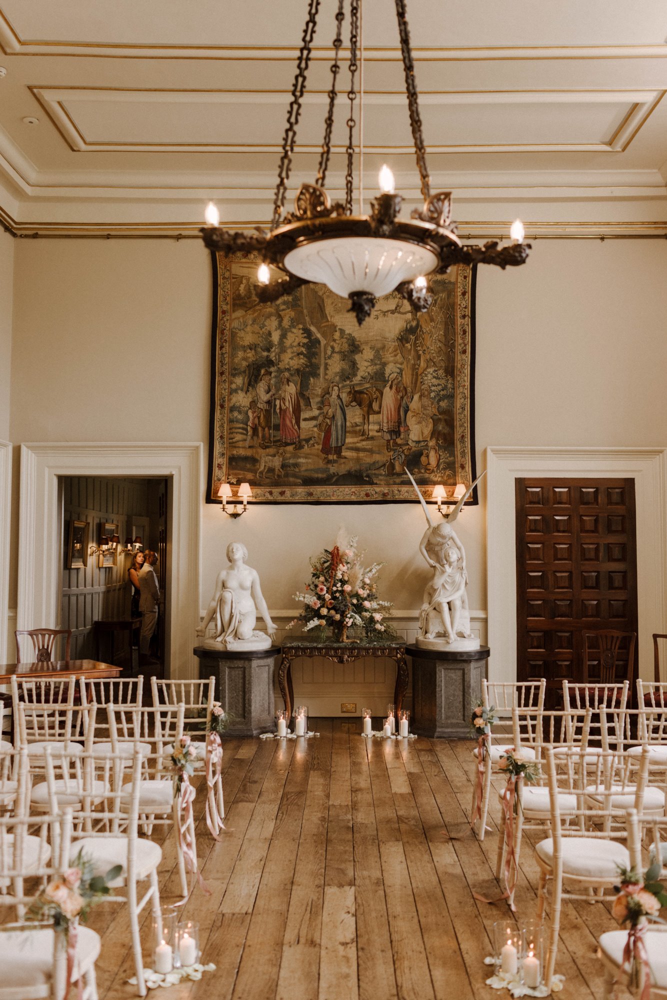 Wedding ceremony decor in the hall at stately home wedding venue in the cotswolds