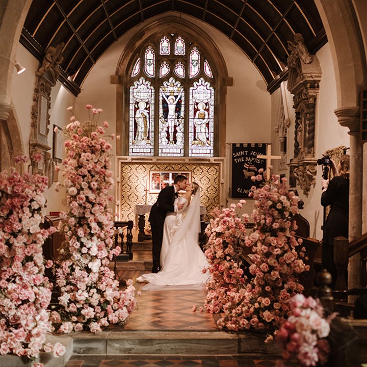 Luxe wedding floral pink arches in a beautiful church in england for a luxury wedding