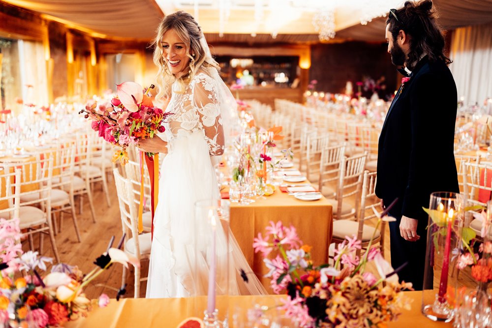 Unconventional bride and groom see their colourful wedding reception for the first time