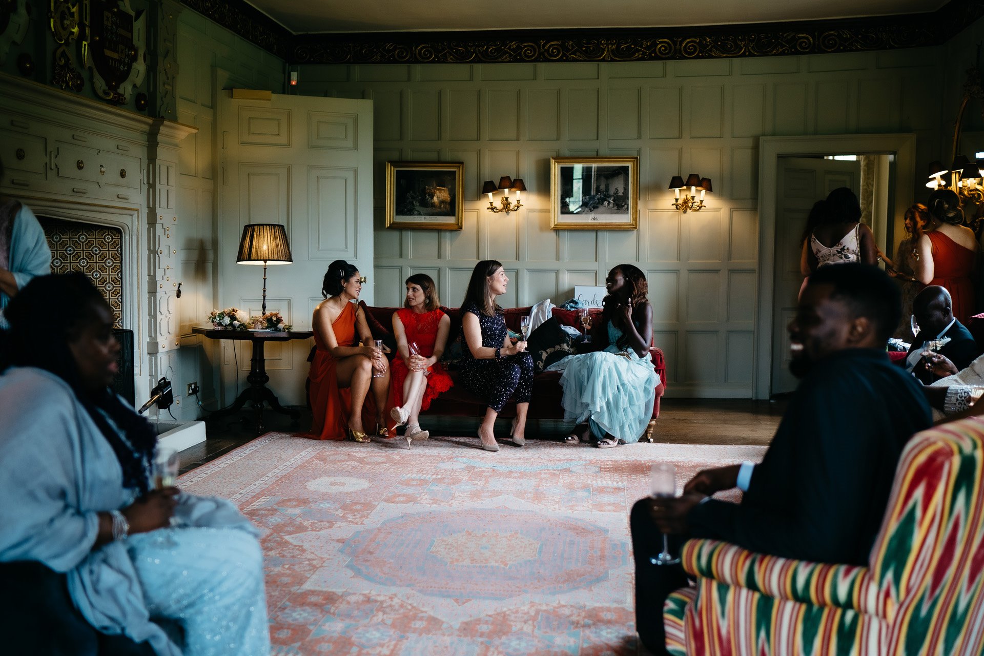 Wedding guests getting comfy in the drawing room at Elmore Court wedding fair in September