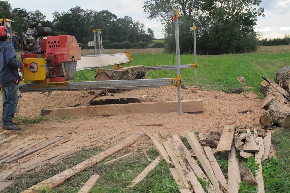 Building eco wedding reception the Gillyflower, cutting and planing timber from the estate at elmore court