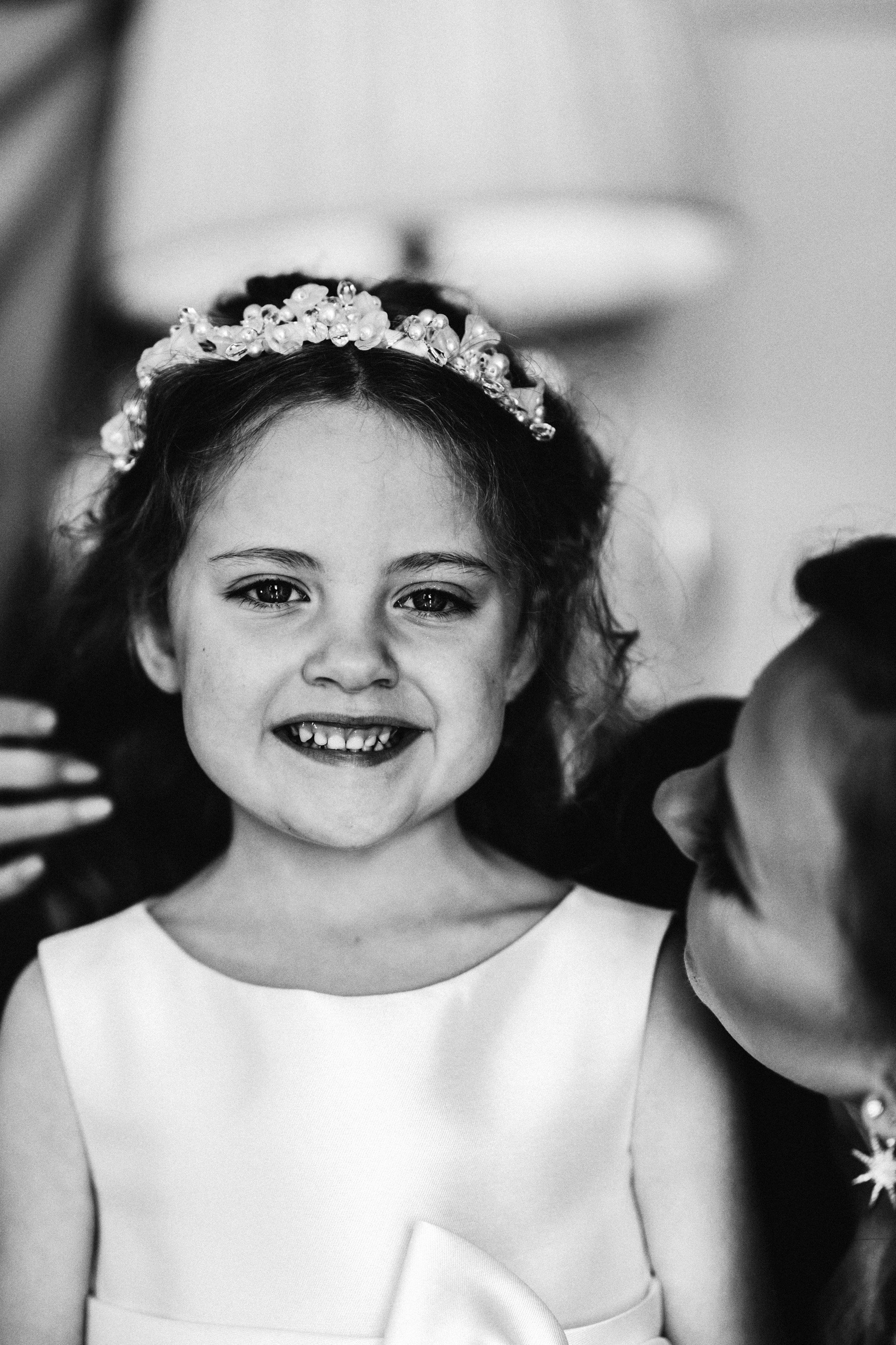 Brides daughter is flower girl with delicate tiara of pearls