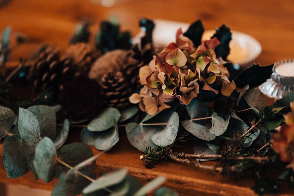 greenery and pinecones for a christmas wedding