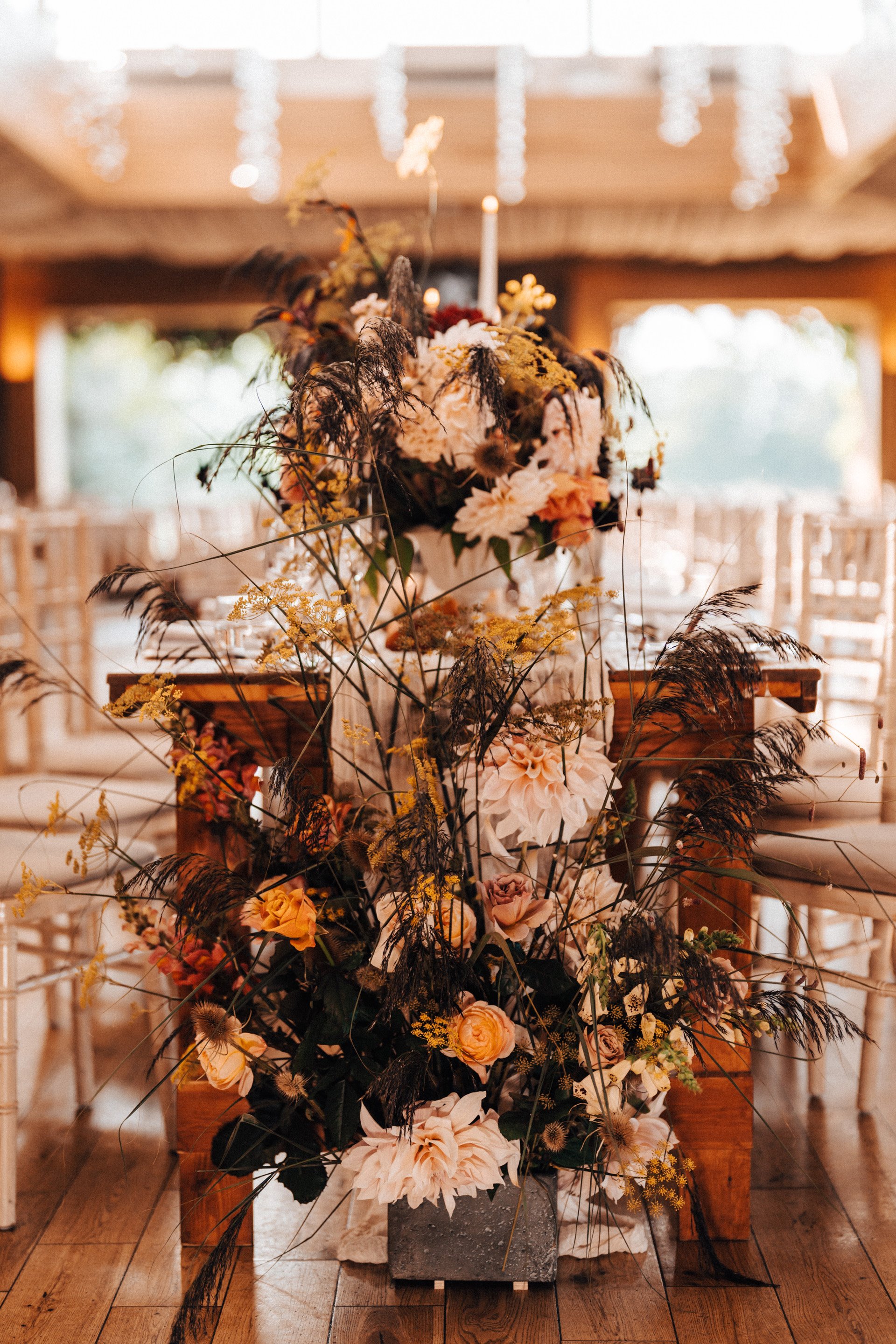 September wedding floral decor on tables at eco venue elmore court