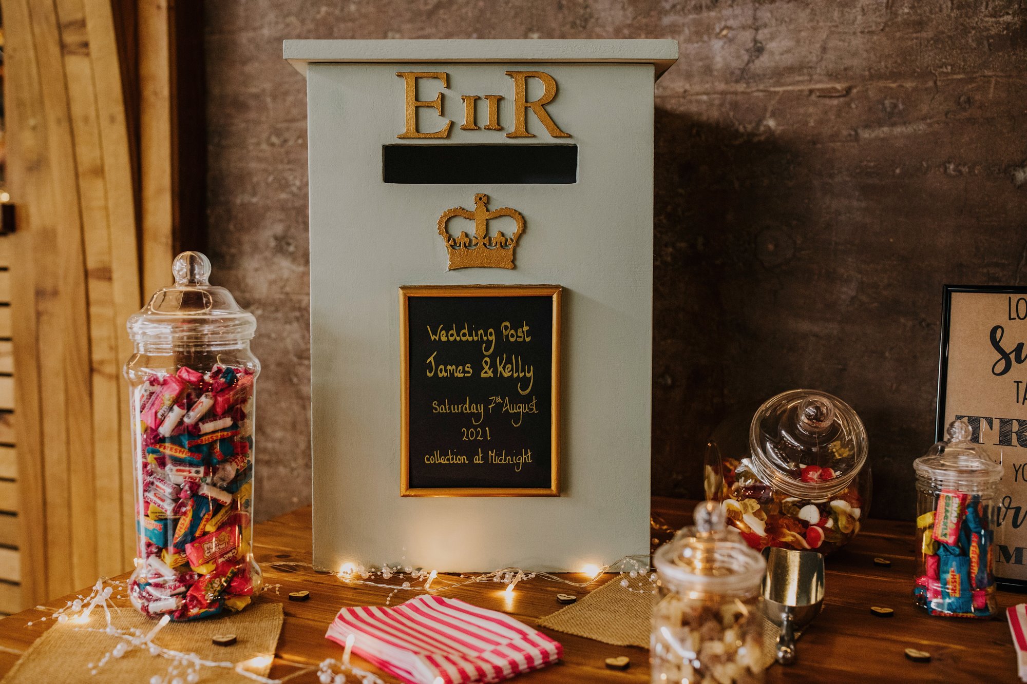 English wedding decor sweet table with a postbox with ER the Queens initials for jubilee inspired wedding