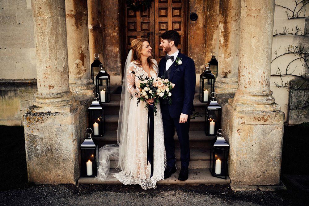 Black ribbon on bouquet and gothic lanterns for subtle dark wedding touches