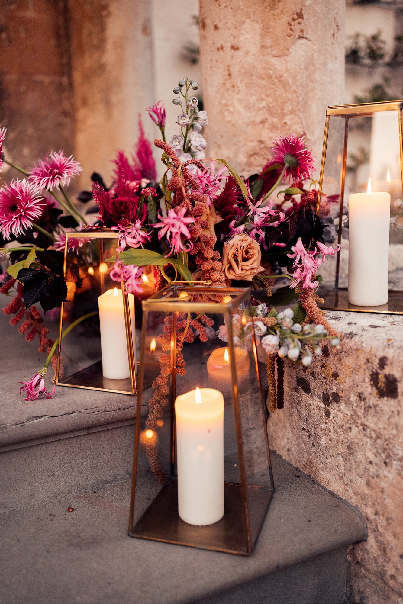 festival wedding flowers and candles decorate steps of mansion house