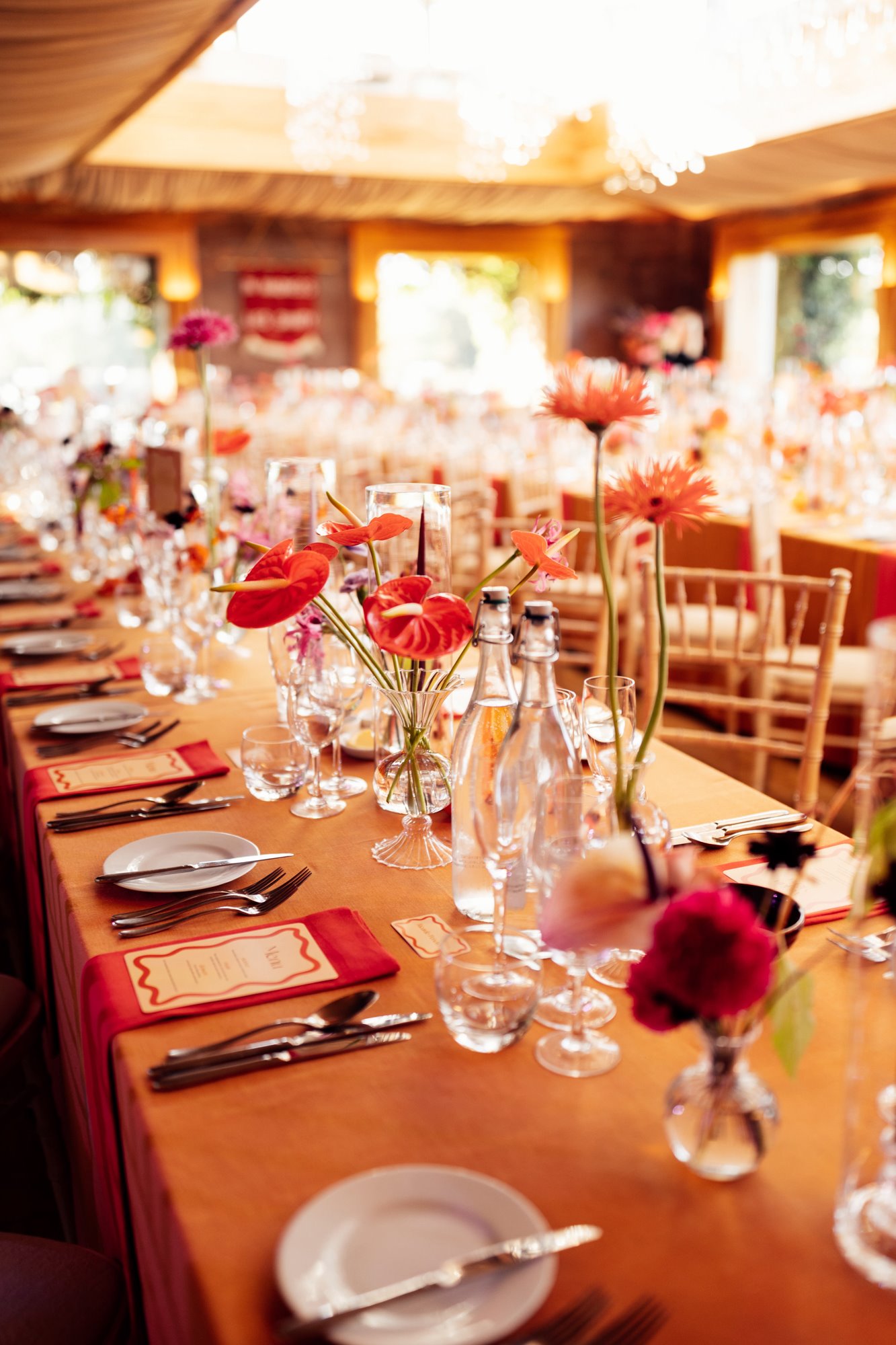 colourful wedding reception tables with bright flowers