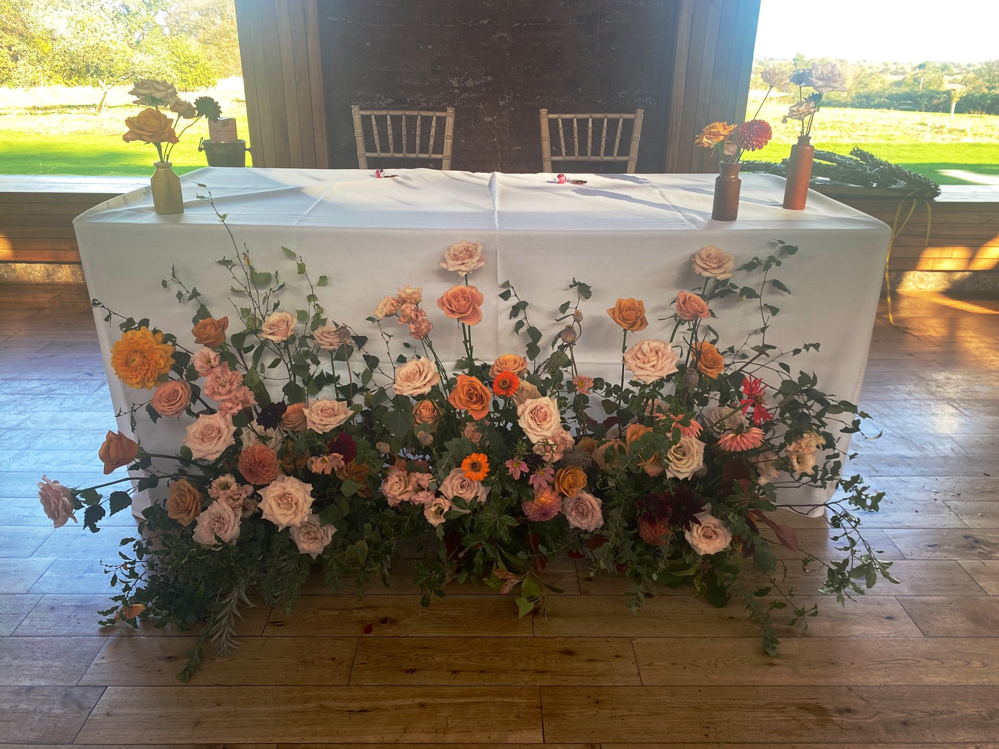 Wildflower meadow table for a sustainable wedding reception in the cotswolds