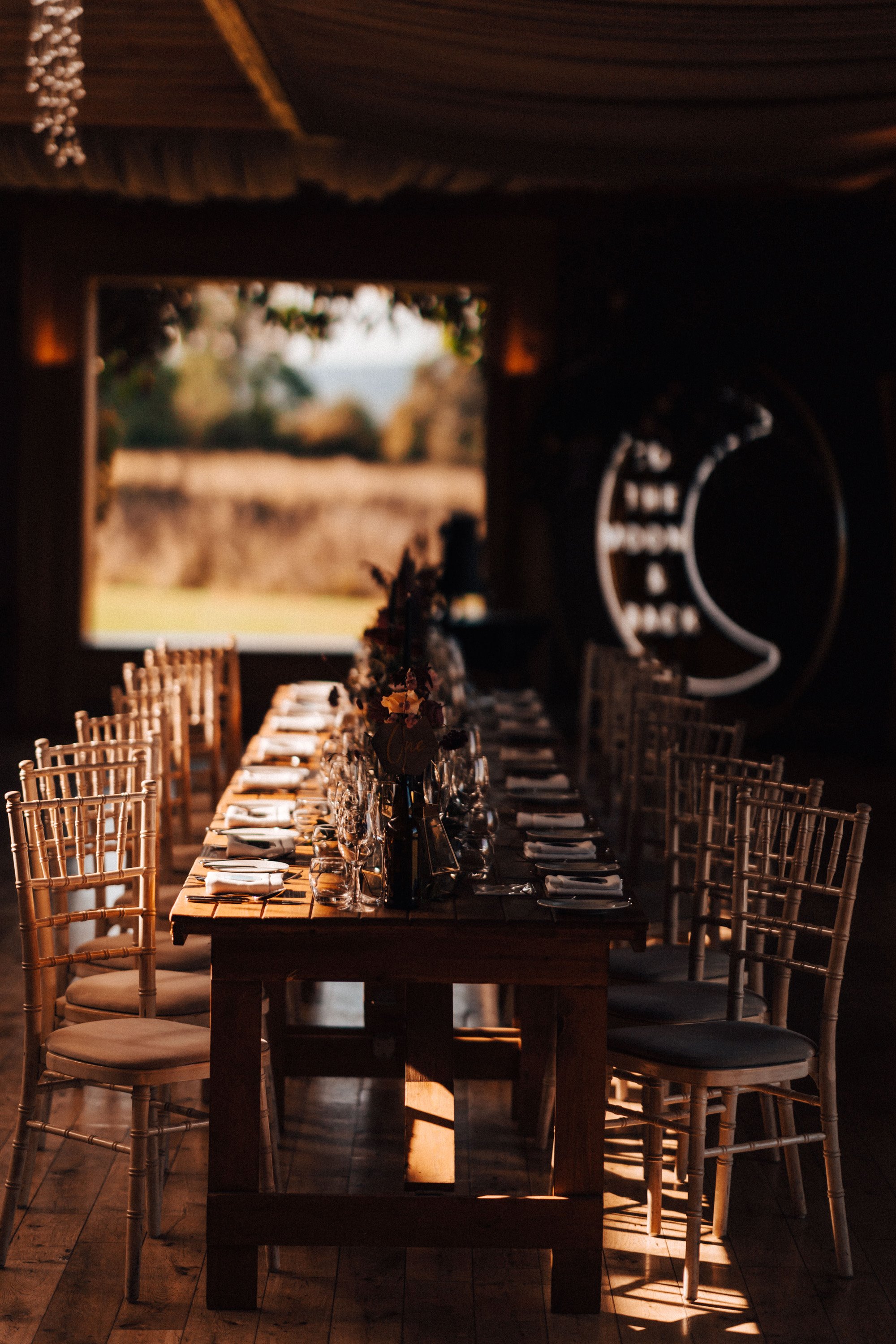 Moody autumn wedding theme with black candles, DIY wedding cake and celestial decor details in October at sustainable venue elmore court