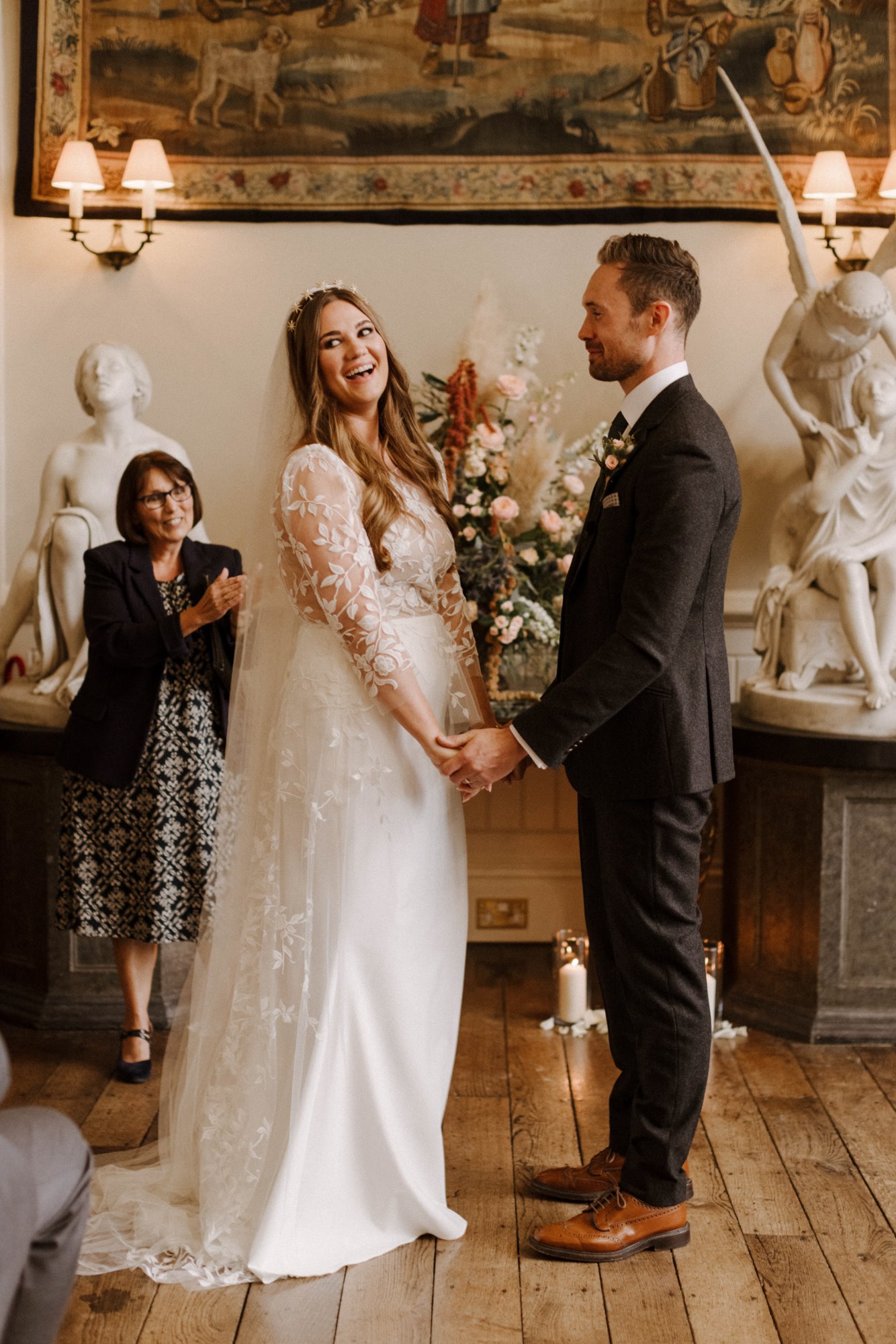 September wedding ceremony coule stand at end of aisle ready to marry